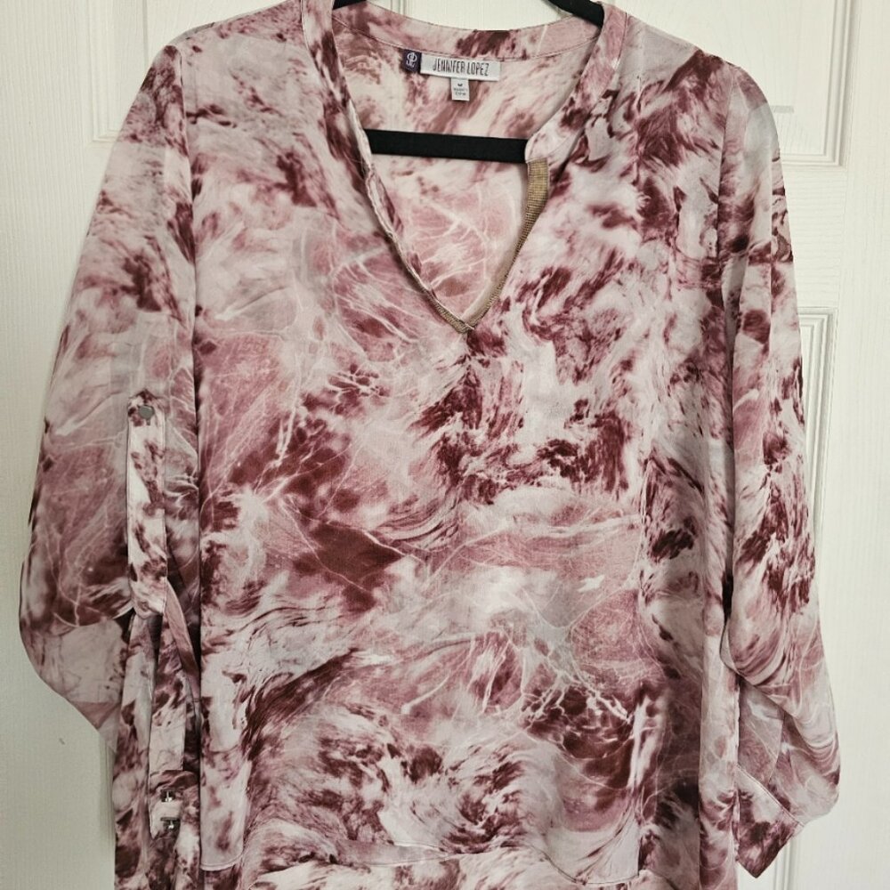 Jennifer Lopez floral blouse.